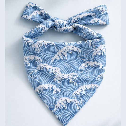 Blue and white wave-patterned bandana on a light gray background