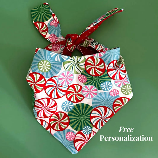 Colorful fabric bunny with candy cane pattern on a green background